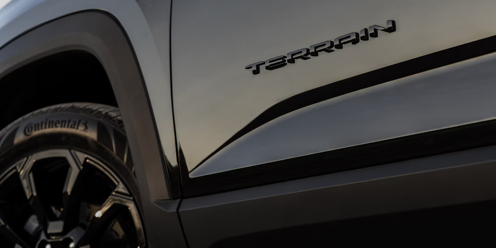 Close-up of Terrain logo on a 2025 GMC Terrain SUV