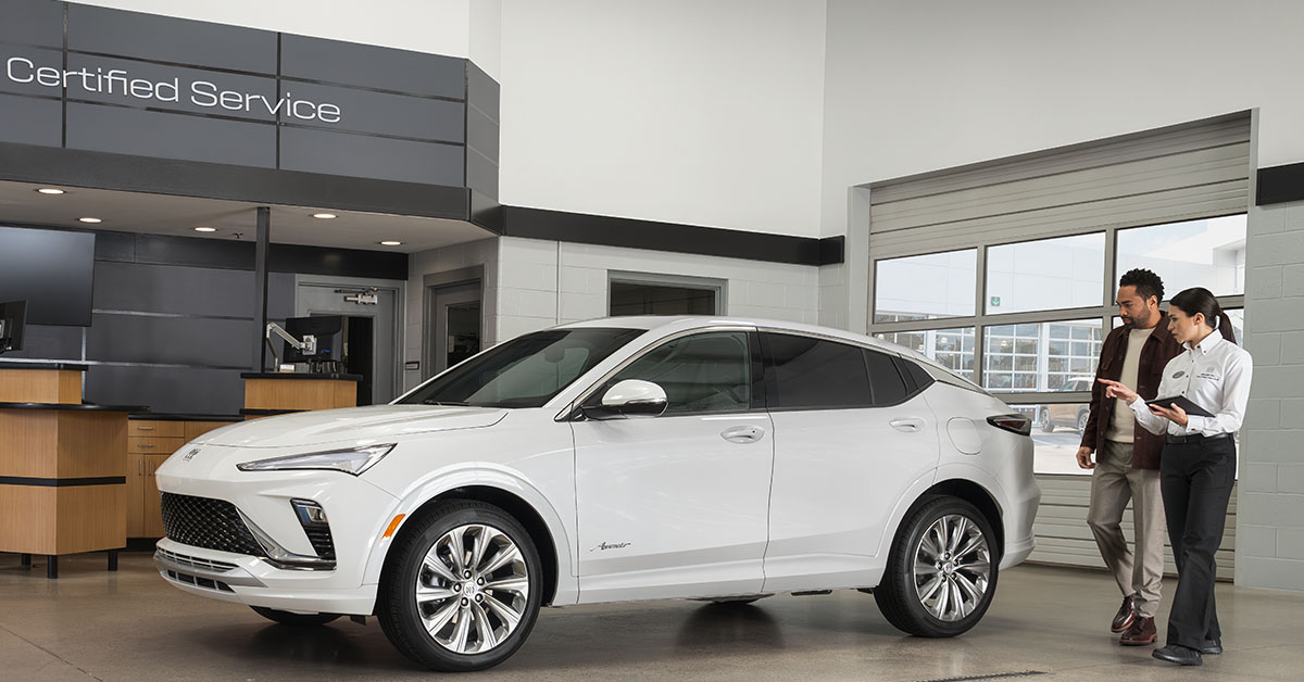 Buick Service Center representative and customer with SUV