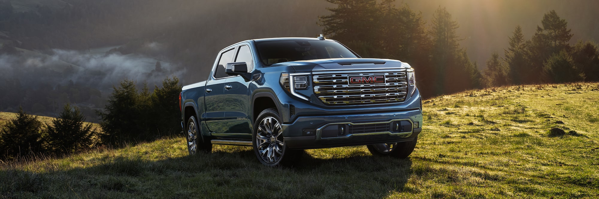 The GMC Sierra 1500 driving up a hill