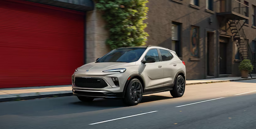 2026 Buick Encore GX SUV driving through city street scene