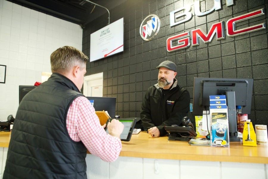 customer signing car lease on a tablet