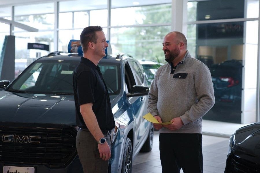 Two people having a conversation in Anderson of Abingdon model showroom